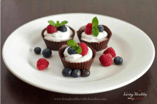 chocolate cups with coconut whipped cream and fresh berries